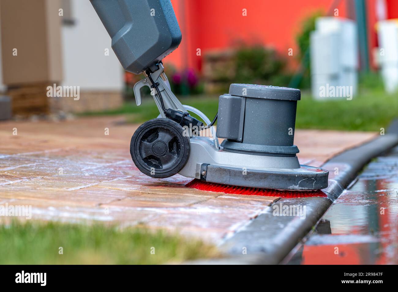 manual cleaning of concrete and stone pavements with a mechanical brush
