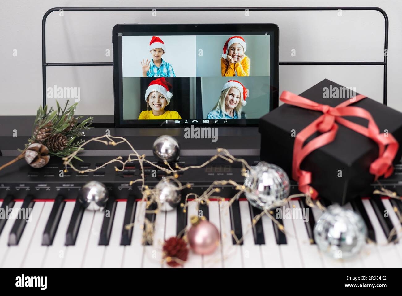 Kid playing piano with teacher hi-res stock photography and images - Alamy