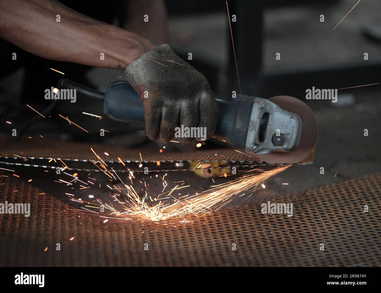 Jakarta, Indonesia June 20, 2023 Cut the iron plate using a grinder