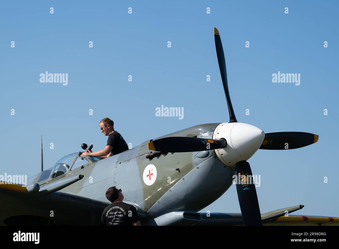 A Supermarine Spitfire is prepared for flying before the annual Duxford Summer Air Show at IWM Duxford in Cambridgeshire. This year marks the 50th anniversary of the first air show at Duxford. Picture date: Sunday June 25, 2023. Stock Photo
