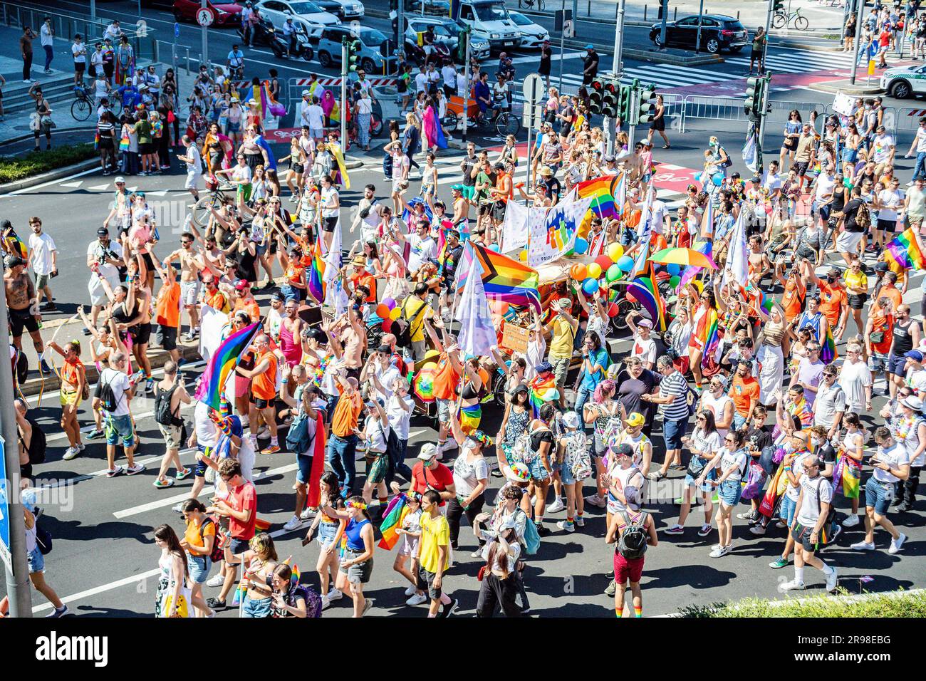 A vibrant crowd of people in the streets of Milan celebrating the ...