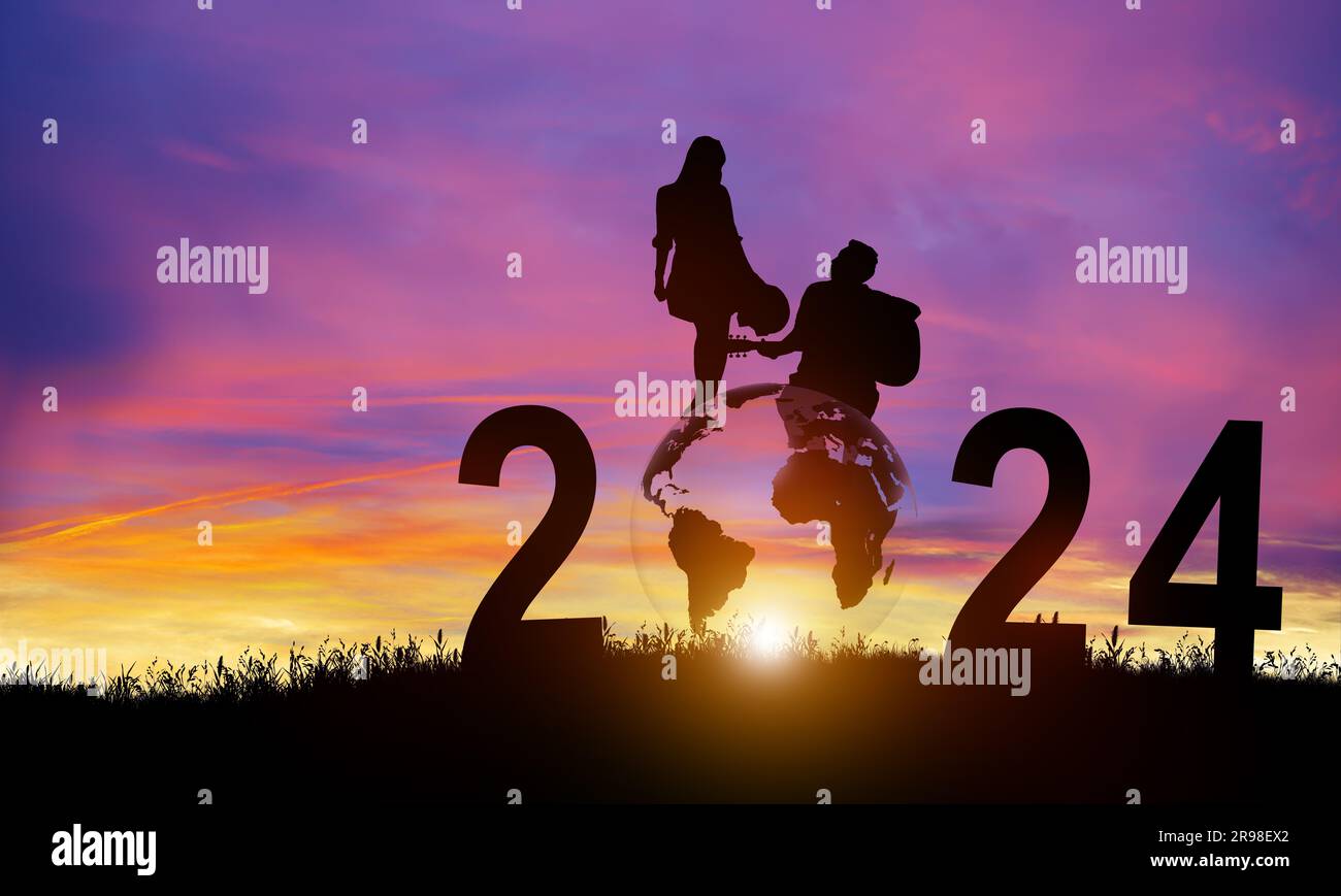 Silhouette 2024 years in sunset background. New Year Celebration for Couple or Partner. Happy New Year and Merry Christmas. Copy space. Stock Photo