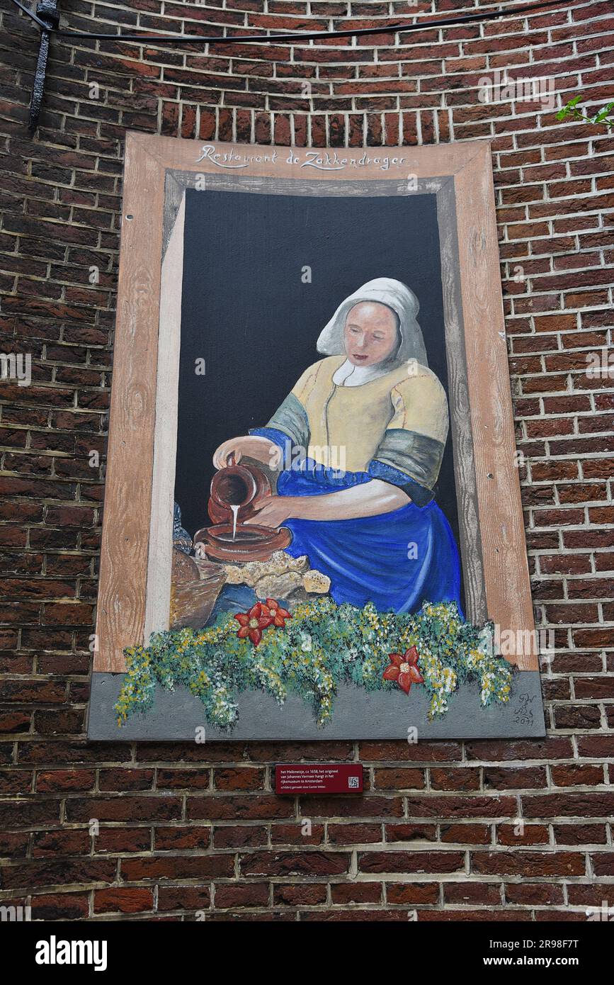 Utrecht, Netherlands. May 9, 2023. A mural of Vermeer's Milkmaid in the centre of Utrecht. High quality photo Stock Photo