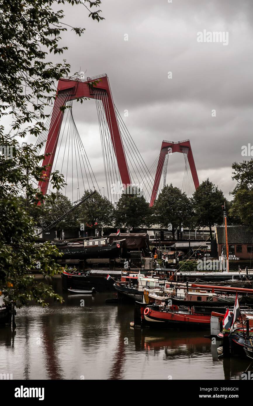 Rotterdam, NL - October 6, 2021: The Willemsbrug bridge with a total span of 318 meters connects the northern section of Rotterdam with the southern p Stock Photo