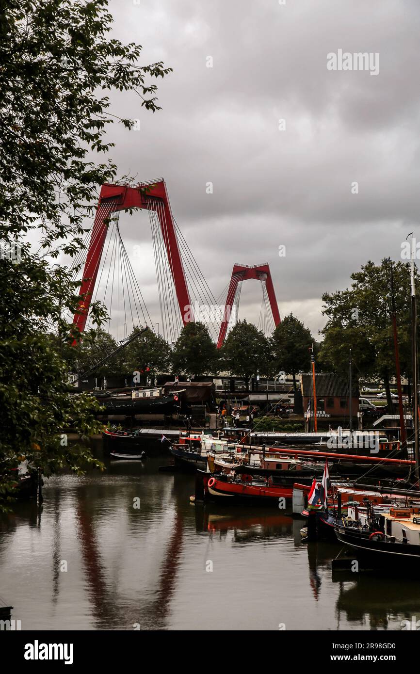 Rotterdam, NL - October 6, 2021: The Willemsbrug bridge with a total span of 318 meters connects the northern section of Rotterdam with the southern p Stock Photo