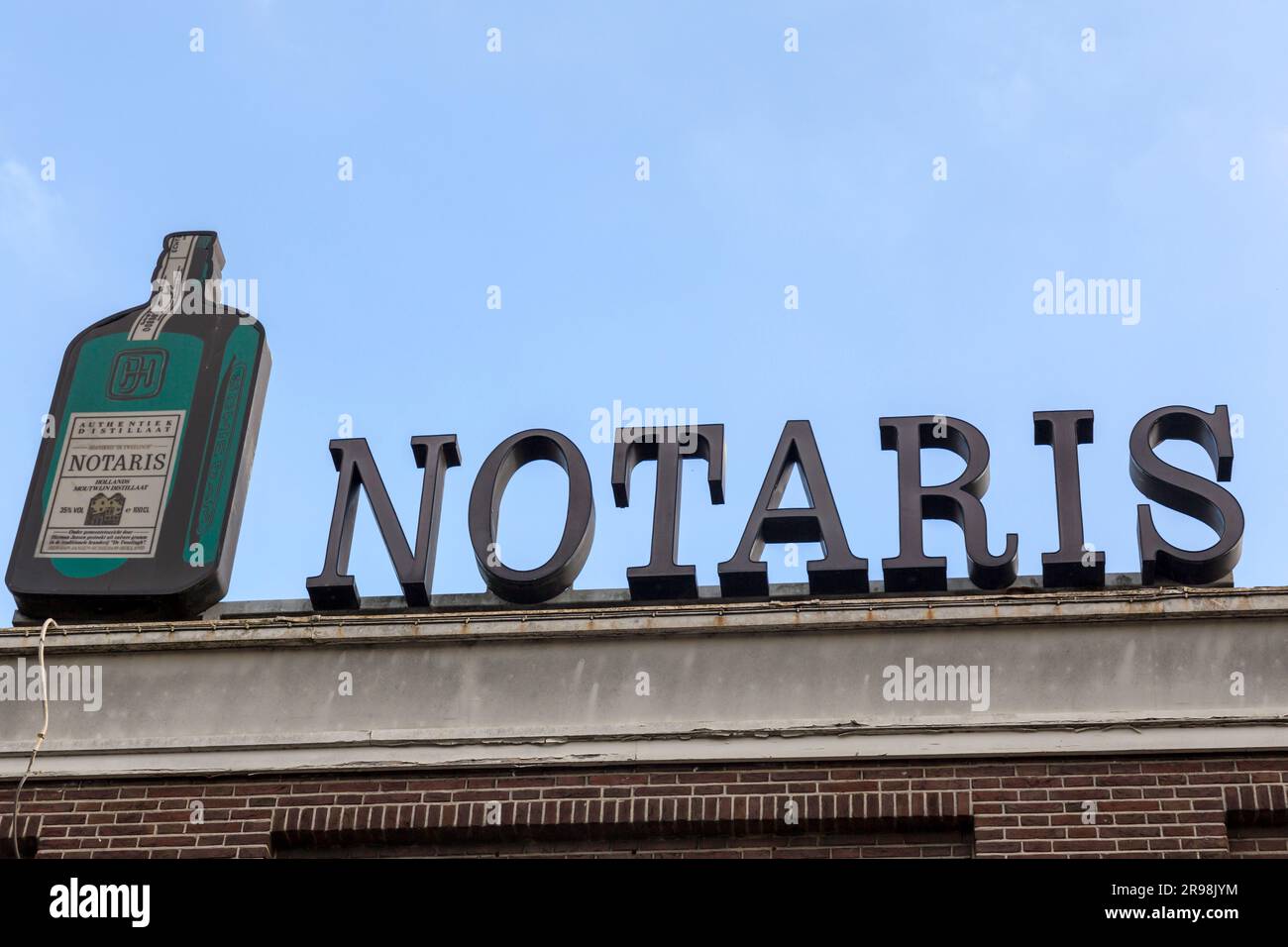 Delft, The Netherlands - October 8, 2021: Notaris, local drink advertisement sign on the top of a building in Schiedam, the Netherlands. Stock Photo