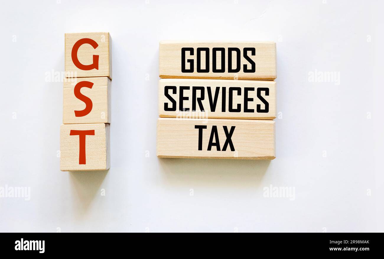 GST alphabet letters on wooden blocks, GST GOODS AND SERVICES TAX