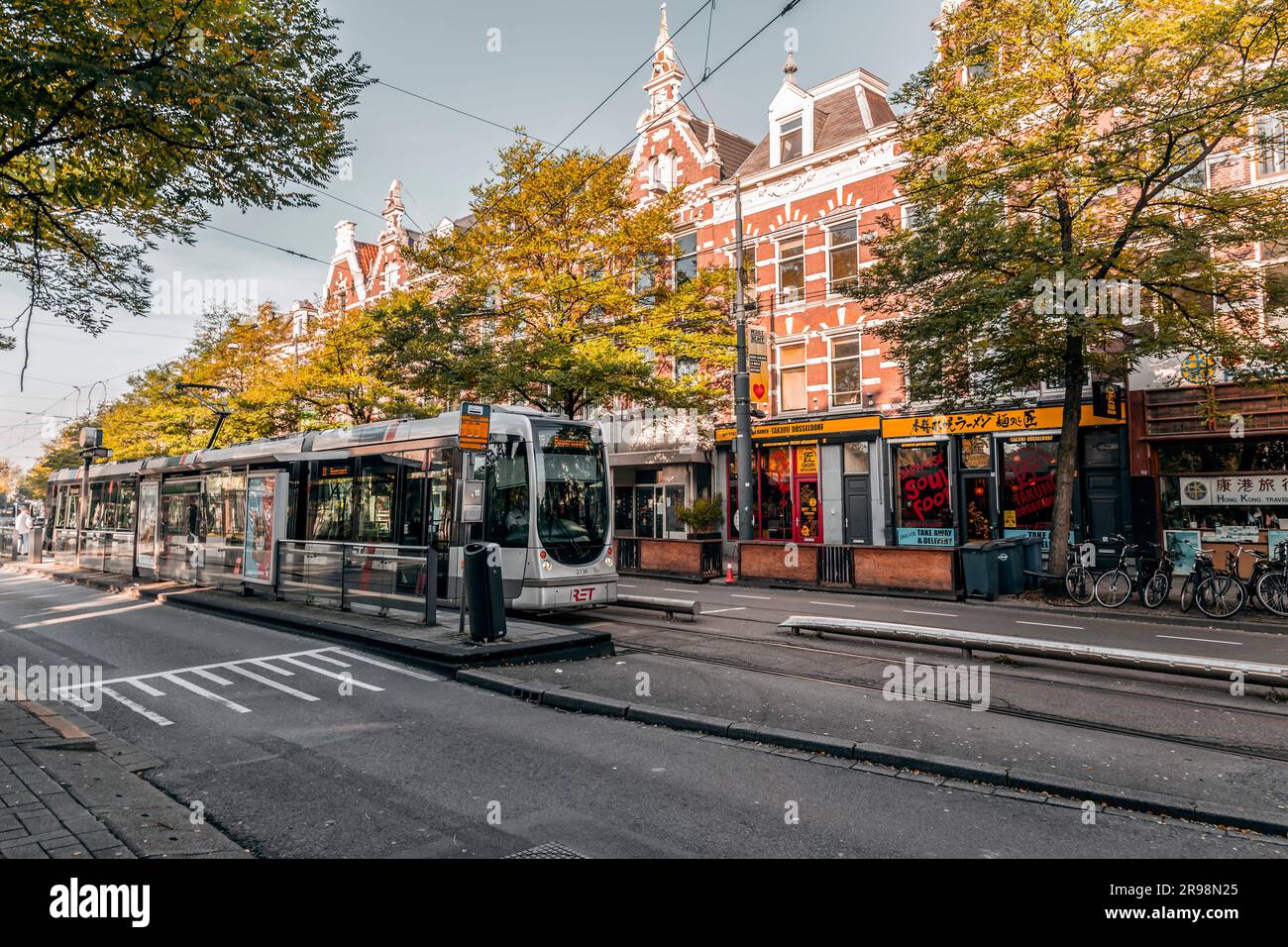 Rotterdam, Netherlands - October 8, 2021: Modern light rail city tram passing through the city of Rotterdam. Rotterdam is the second largest city of t Stock Photo