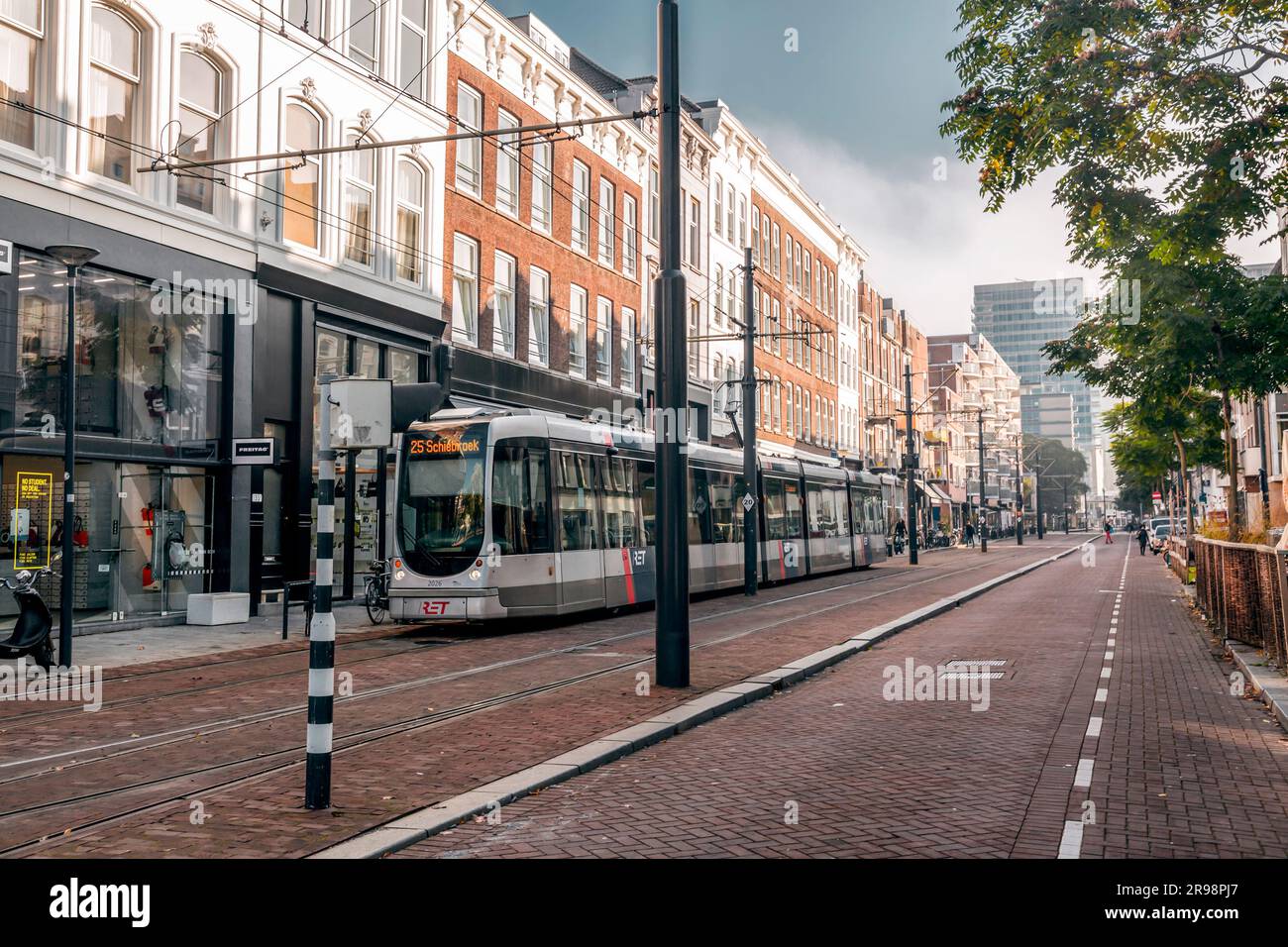 Rotterdam, Netherlands - October 8, 2021: Modern light rail city tram passing through the city of Rotterdam. Rotterdam is the second largest city of t Stock Photo