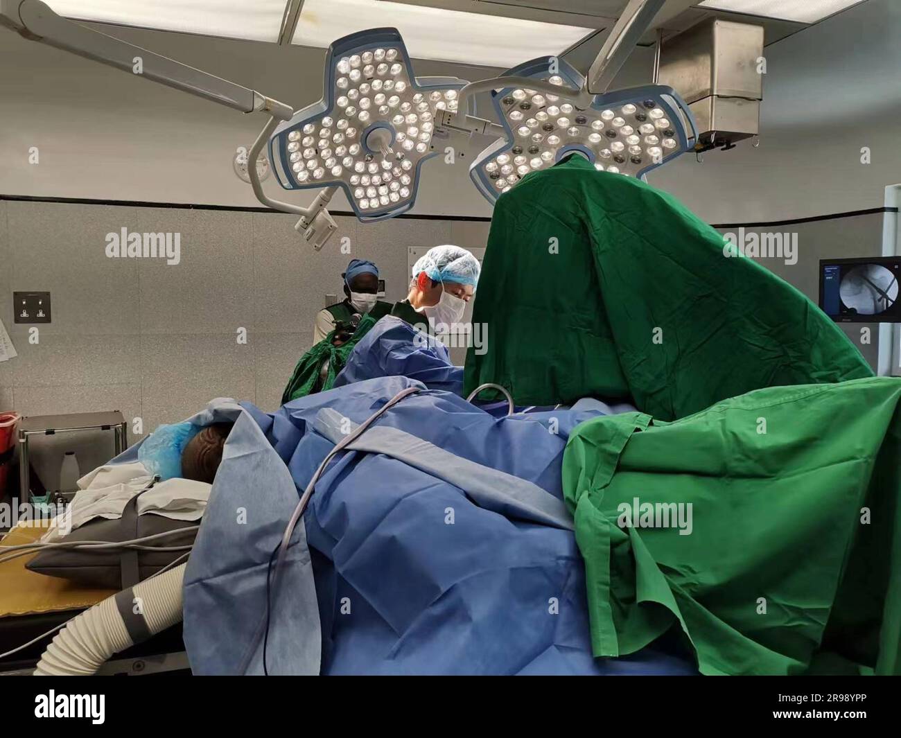 Bridgetown. 25th June, 2023. He Ping, the chief surgeon of the trauma department at the Chongqing Emergency Medical Center and a member of the third Chinese medical team to Barbados, conducts a surgery at the Queen Elizabeth Hospital in Bridgetown, Barbados, July 31, 2019. TO GO WITH 'Feature: Chinese medical care safeguards Barbadians' well-being' Credit: Xinhua/Alamy Live News Stock Photo