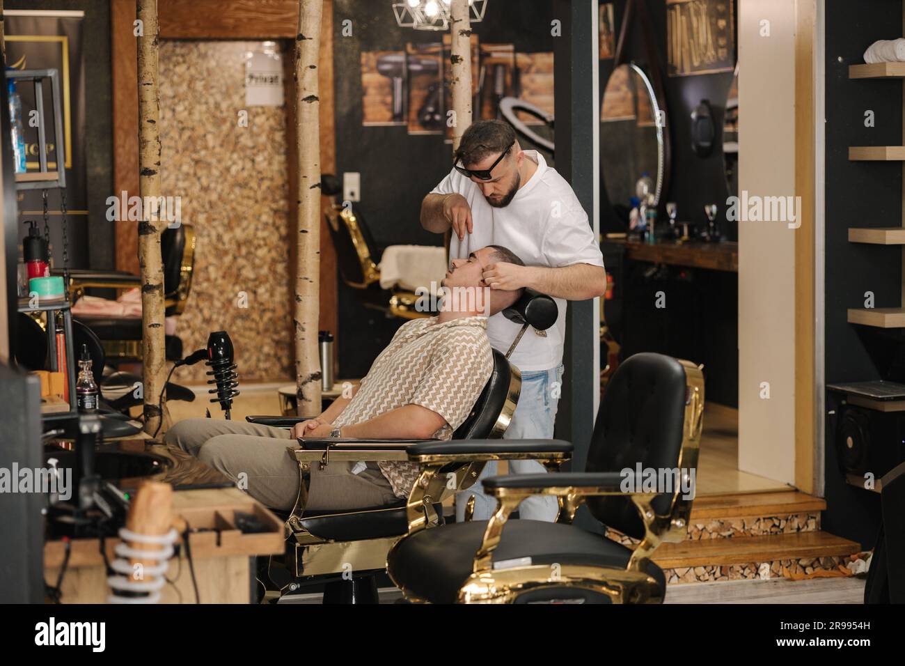 Side view process of threading procedure in barber shop. Professional