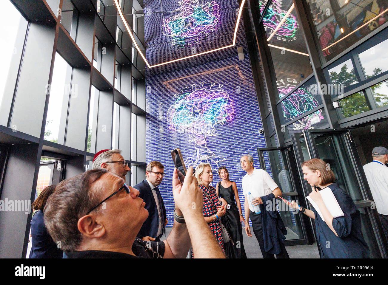 Berlin, Germany. 25th June, 2023. Visitors stand inside the building