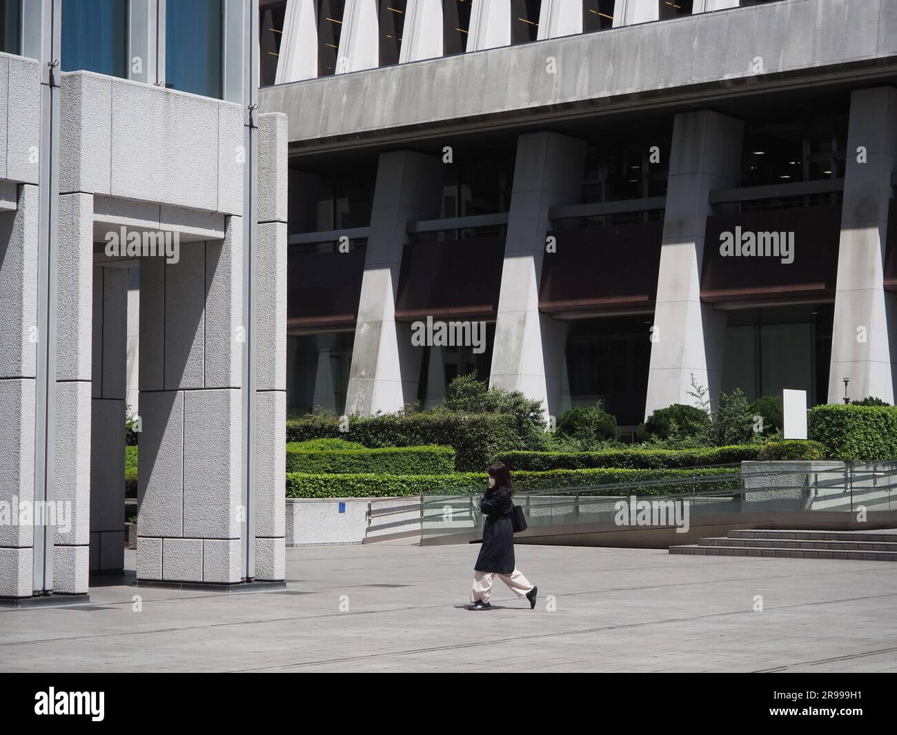 TOKYO, JAPAN - May 2, 2023: Front of the Shinjuku Nomura Building in central Tokyo on a windy day. Sompo Japan Building is in the background. Stock Photo