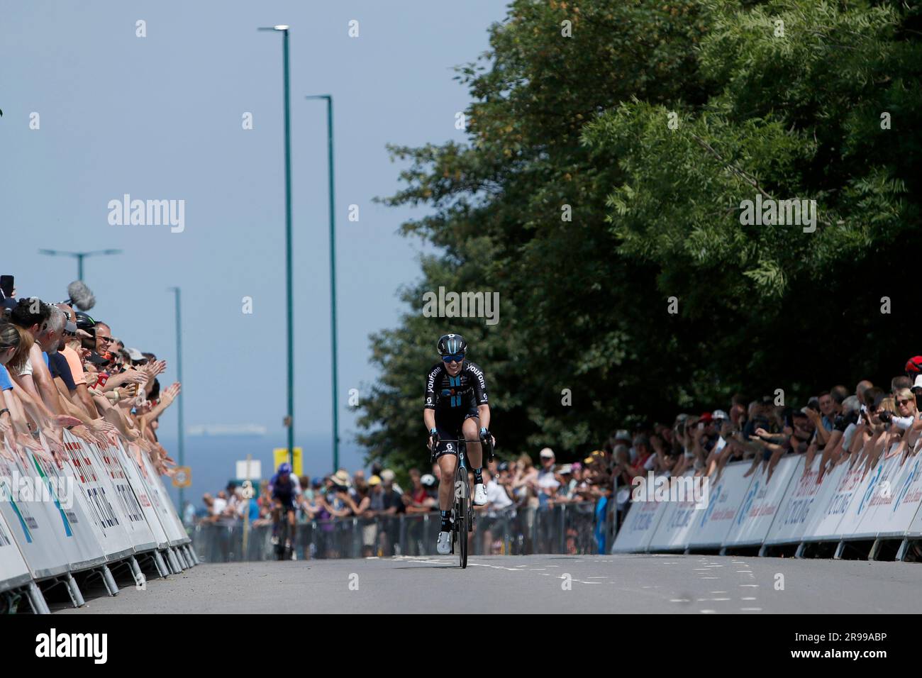 Team DSM's Pfeiffer crosses the line to win the women's road