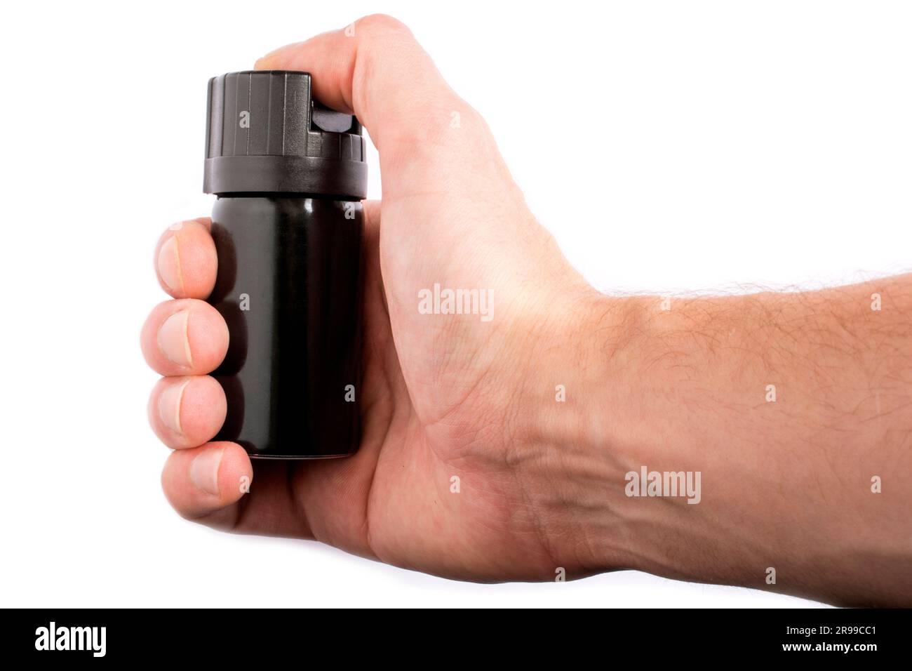 Hand with bottle of pepper spray in eyes, isolated on white background