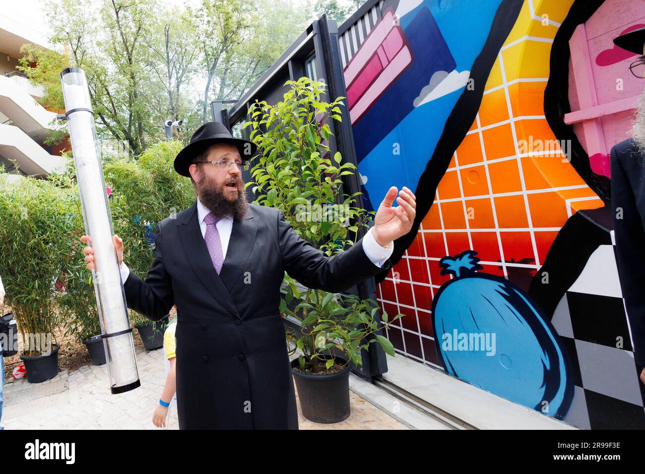 Berlin, Germany. 25th June, 2023. Rabbi Yehuda Teichtal holds a mezuzah