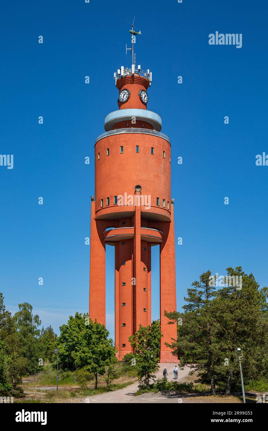Bright red water tower, designed by Bertel Liljequist and built in 1943, against clear blue sky on a sunny summer day in Hanko, Finland Stock Photo