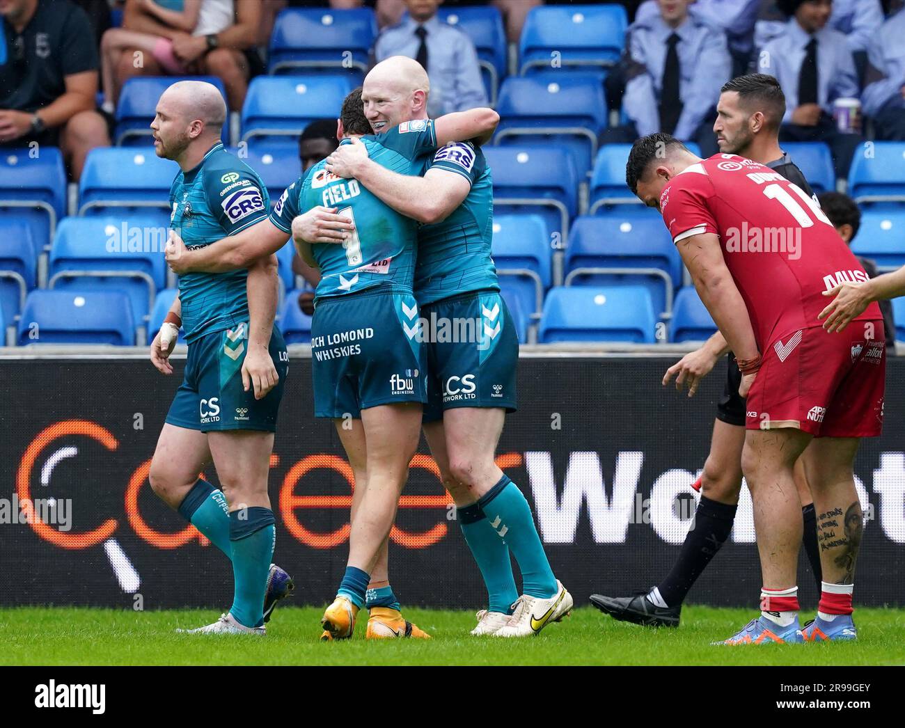 Wigan Warriors' Liam Farrell (centre right) celebrates scoring their ...