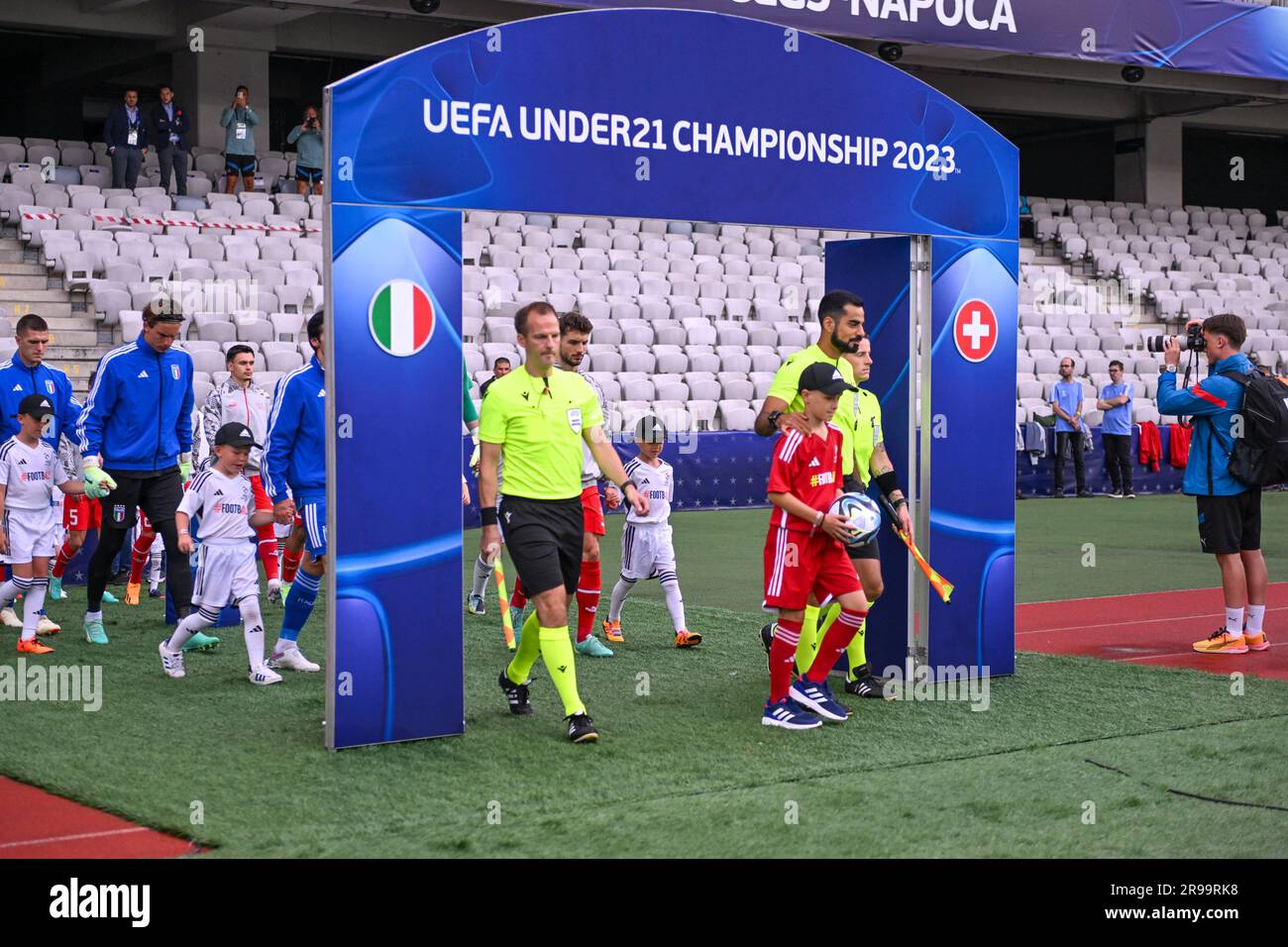 Cluj Napoca, Romania. 25th June, 2023. Arbitration Terna under the UEFA U21 Championshio 2023 alignment arc enters the field during the first qualifying round UEFA European Under-21 Championship 2023 soccer match Italy U21 vs. Swiss U21 at the Cluj Arena stadium in Cluj Napoca, Romania, 25nd of June 2023 Credit: Live Media Publishing Group/Alamy Live News Stock Photo