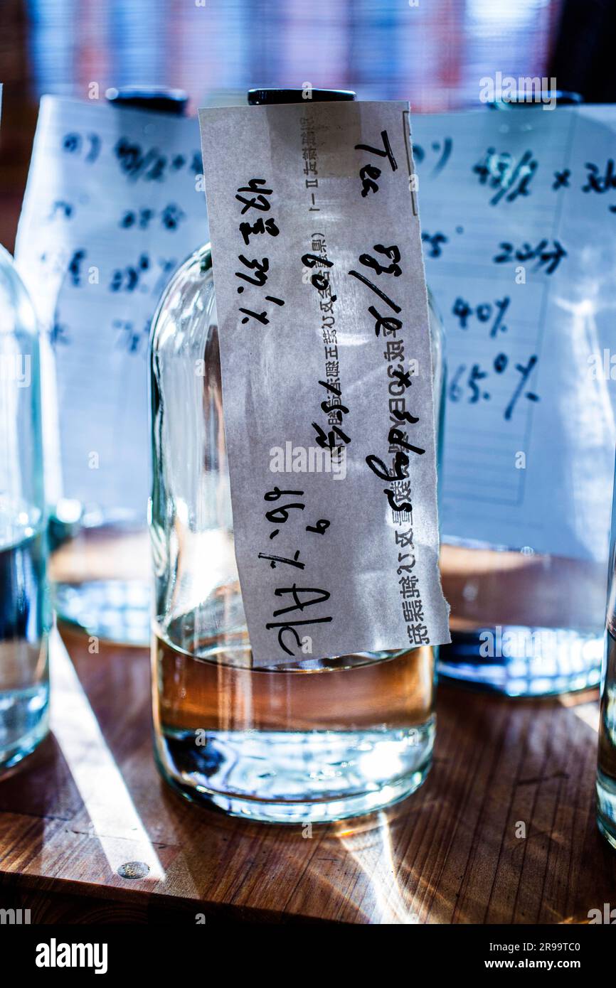 Sake brewery bottles of neutral alcohol where distilled alcohol is added to sake, Japan. Stock Photo