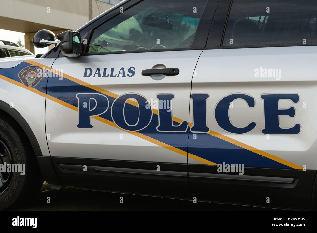 Dallas, OR, USA - June 13, 2023; Closeup of name and badge on Dallas police car in Polk County Oregon Stock Photo