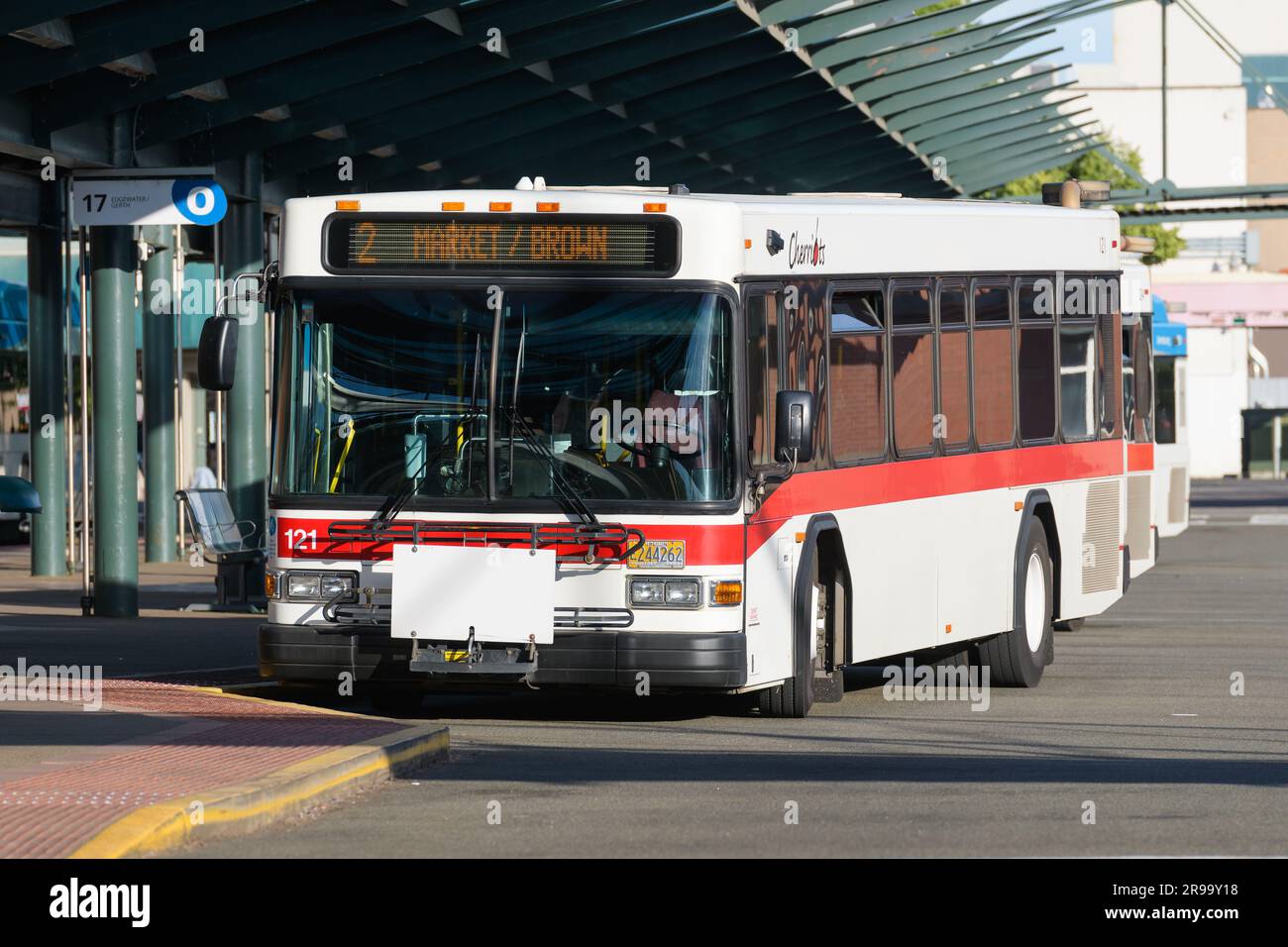 Salem, OR, USA - June 13, 2023; Salem red and white Cherriots local bus at the central bus station Stock Photo