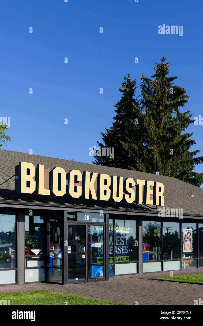 Bend, OR, USA - June 16, 2023; Facade and yellow sign on last ...
