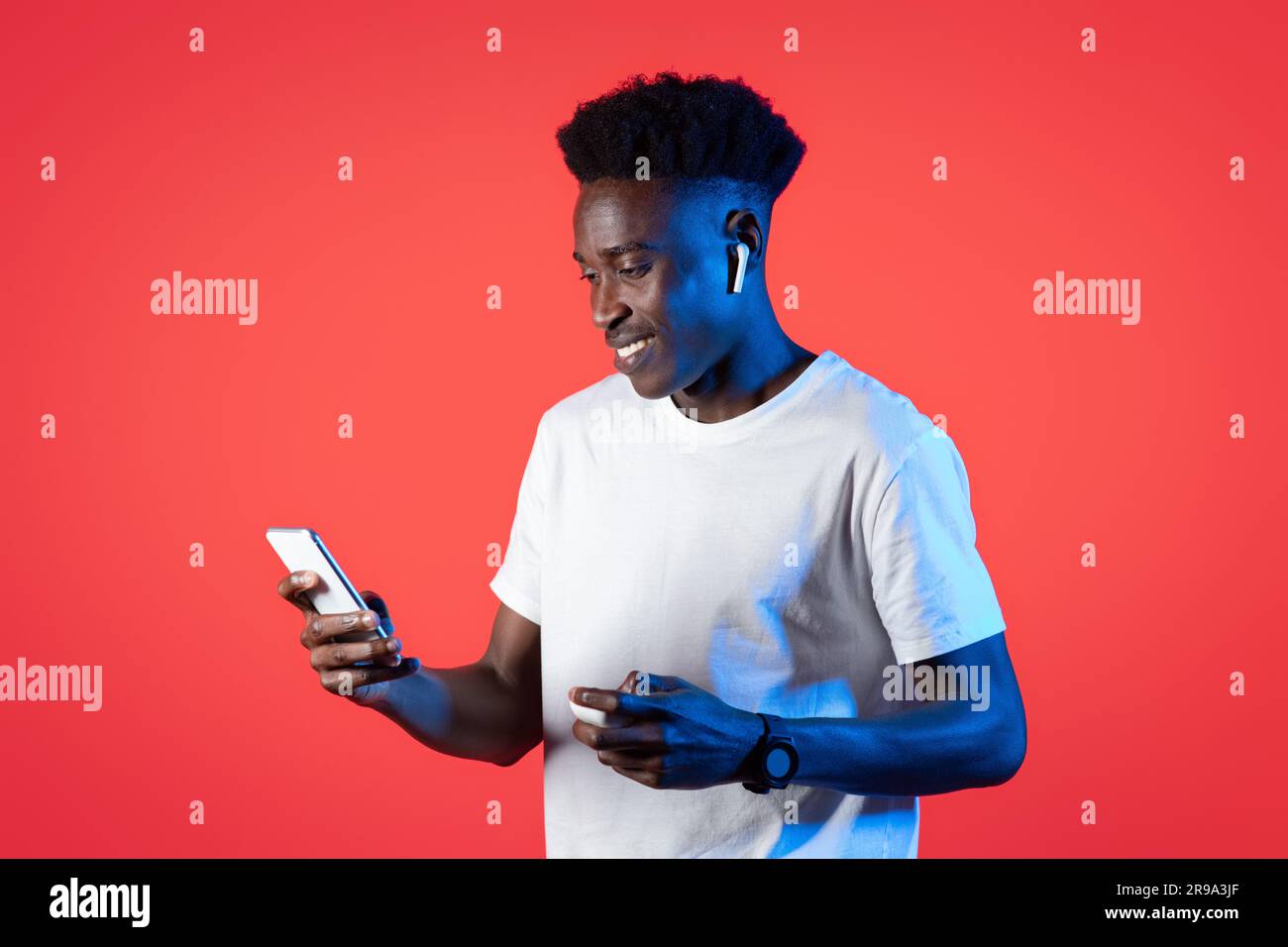 Young black african guy red hi-res stock photography and images - Alamy