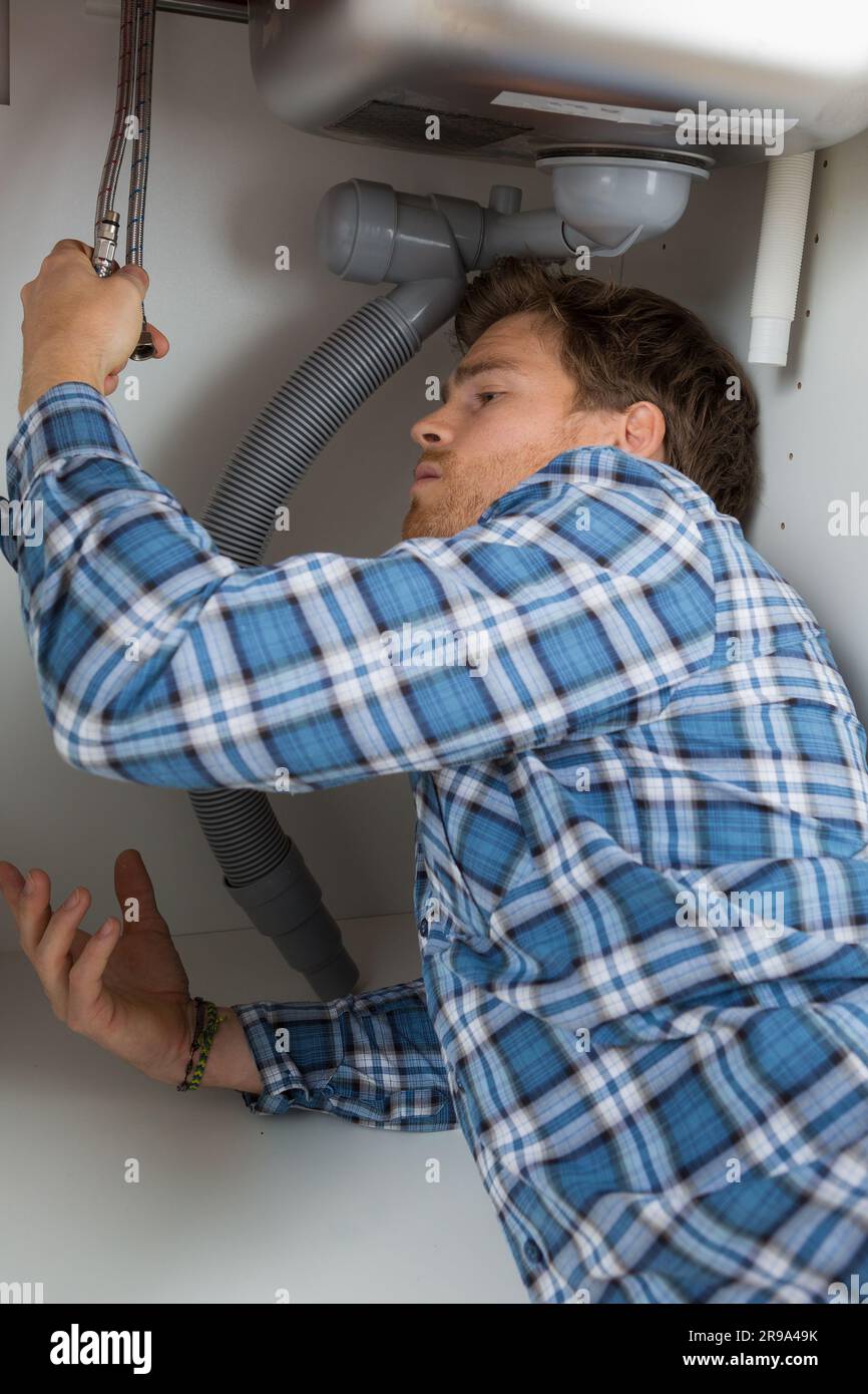 Awkwardly hi-res stock photography and images - Alamy