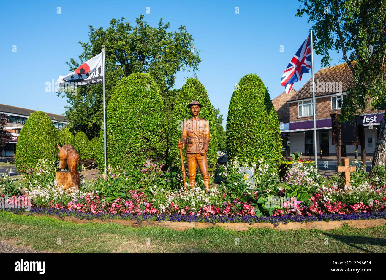 100 year anniversary WWI commemorative plantation and war memorial surrounded by a garden of flowers in Summer in Rustington, West Sussex, England, UK Stock Photo