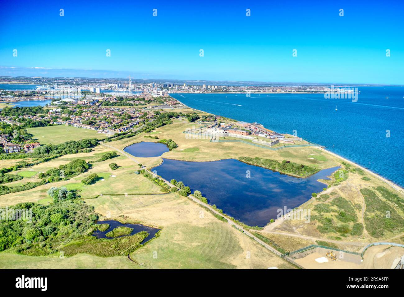 Gilkicker Lagoon and Gosport and Stokes Bay Golf Course towards the entrance to  Portsmouth harbour, Aerial photo. Stock Photo