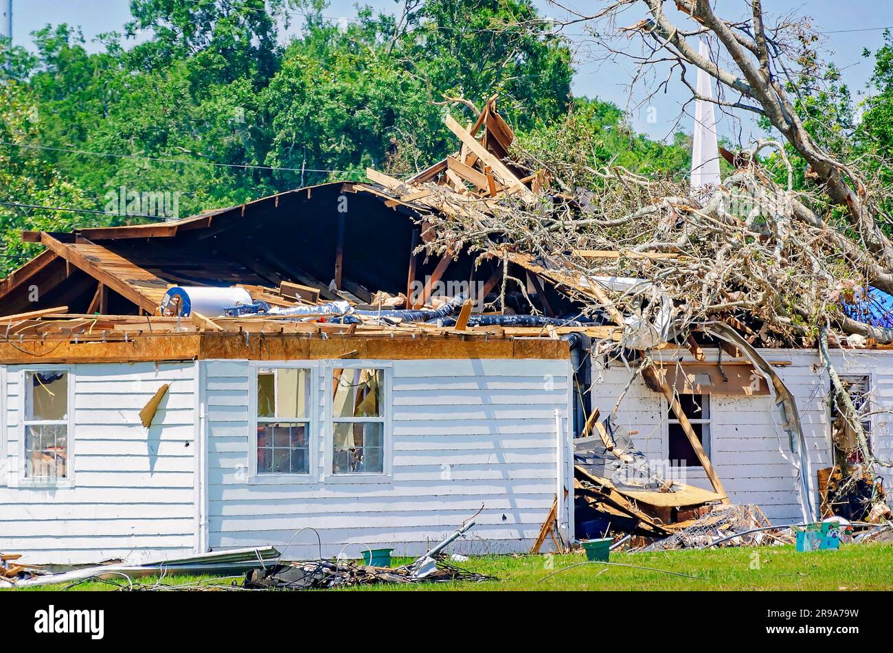 A house stands amid tornado damage, June 24, 2023, in Moss Point, Mississippi. An EF-2 tornado struck on June 19, 2023. Stock Photo