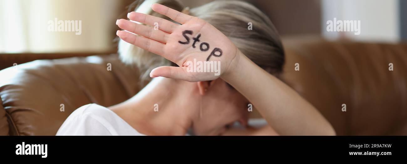 Woman showing palm with stop lettering, protesting against domestic ...