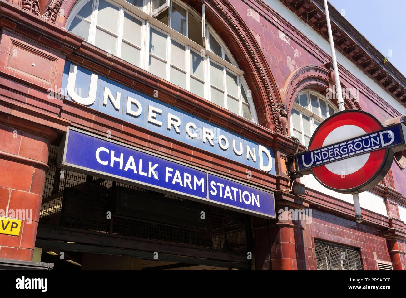 The Grade II listed front facade of Chalk Farm underground station with the station name and the famous London Underground roundel symbol. London, UK Stock Photo