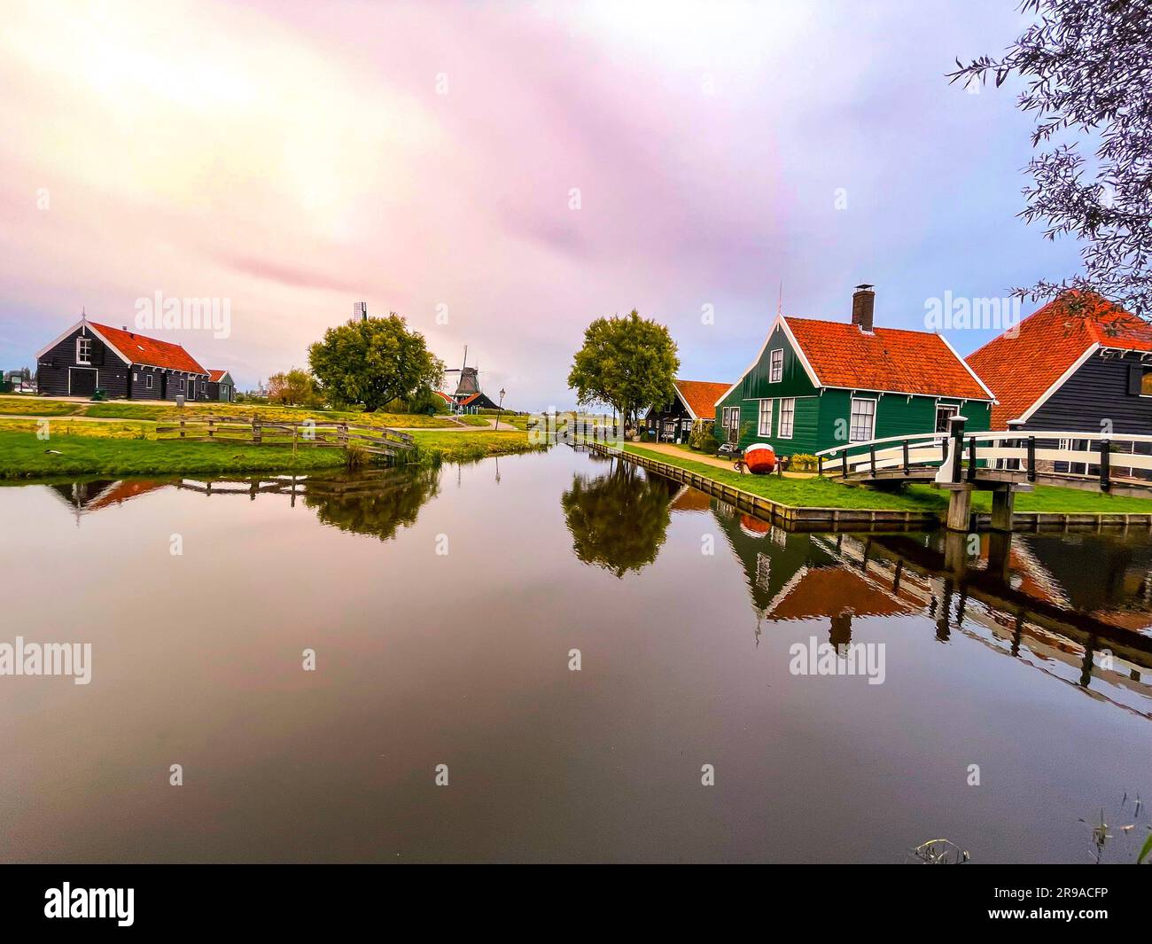Zaanse Schans is a neighbourhood of Zaandam, near Zaandijk, Netherlands, famous for its collection of well-preserved historic windmills and houses. Stock Photo