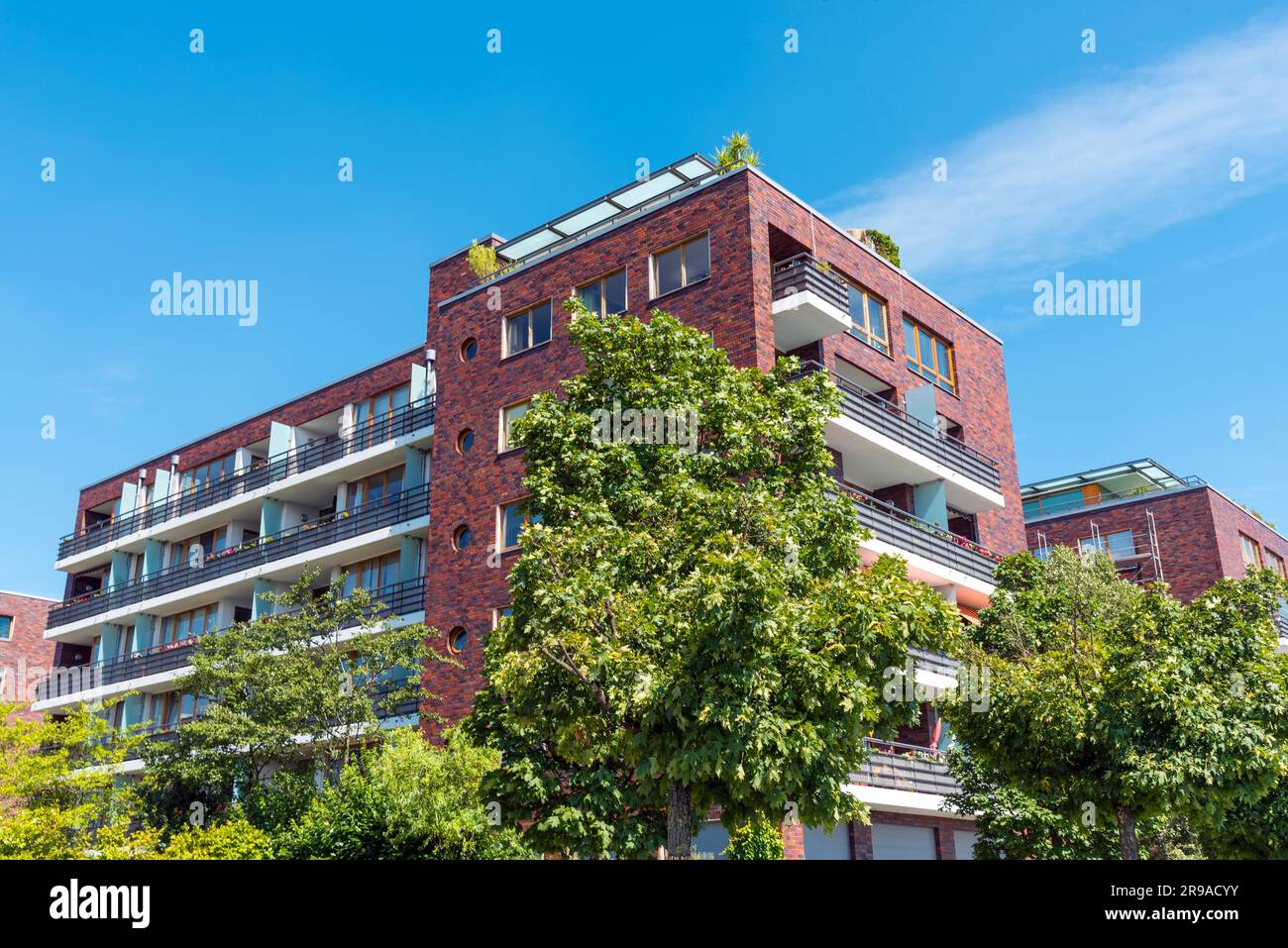 Red brick apartment building in hi-res stock photography and