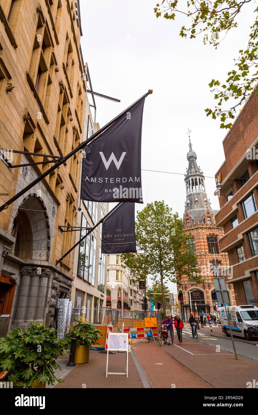 Amsterdam, Netherlands - October 17, 2021: The logo of W Hotel Amsterdam Bank on a flag at the entrance of the hotel building in Amsterdam, Netherland Stock Photo