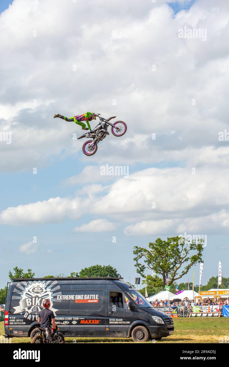 Motorcycle stunt rider from the extreme bike battle display team doing stunt jumps at the royal Cheshire show of 2023 Stock Photo