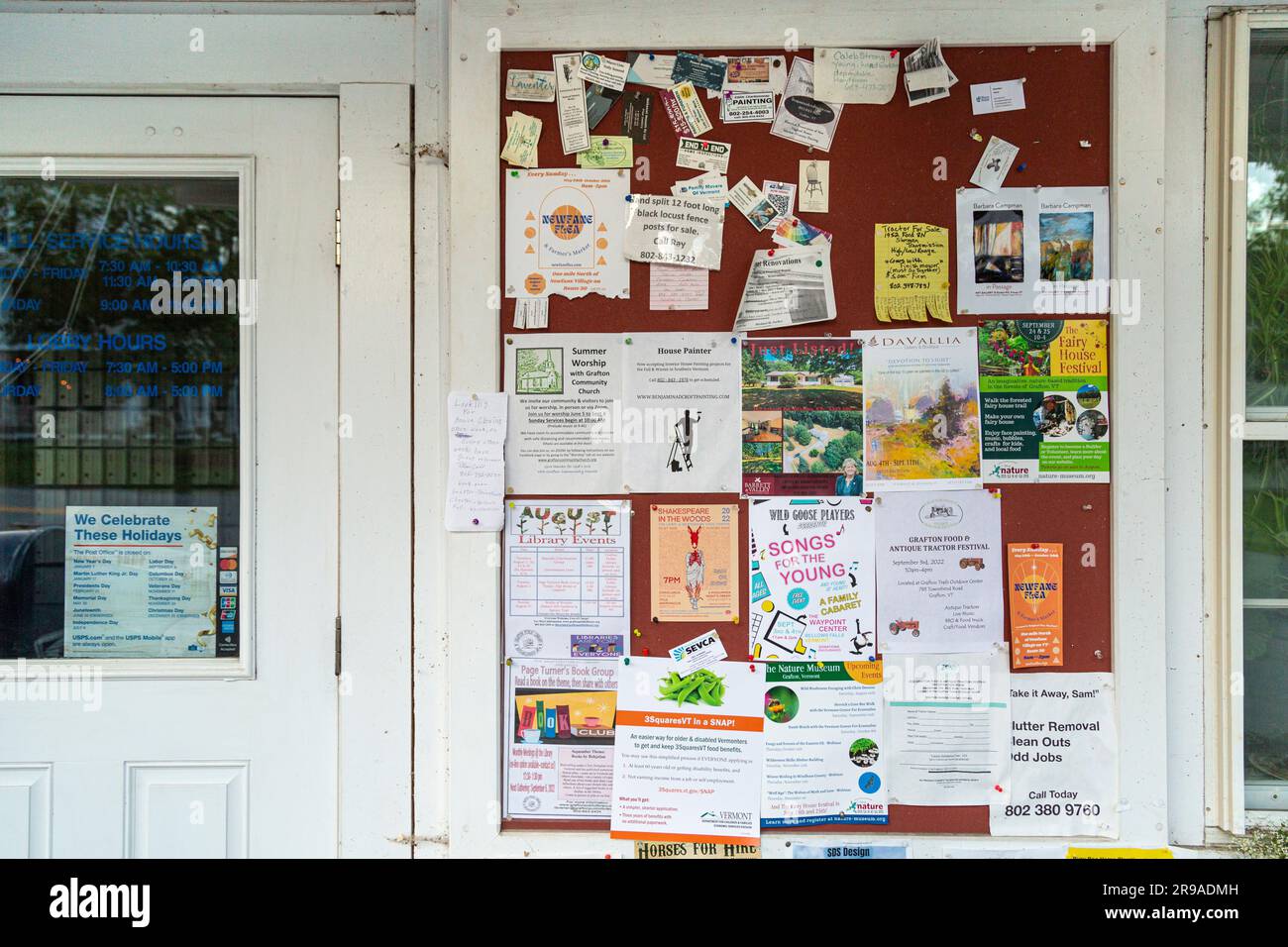 postings and flyers on community bulletin board in tiny New England Village, Grafton, Vermont Stock Photo