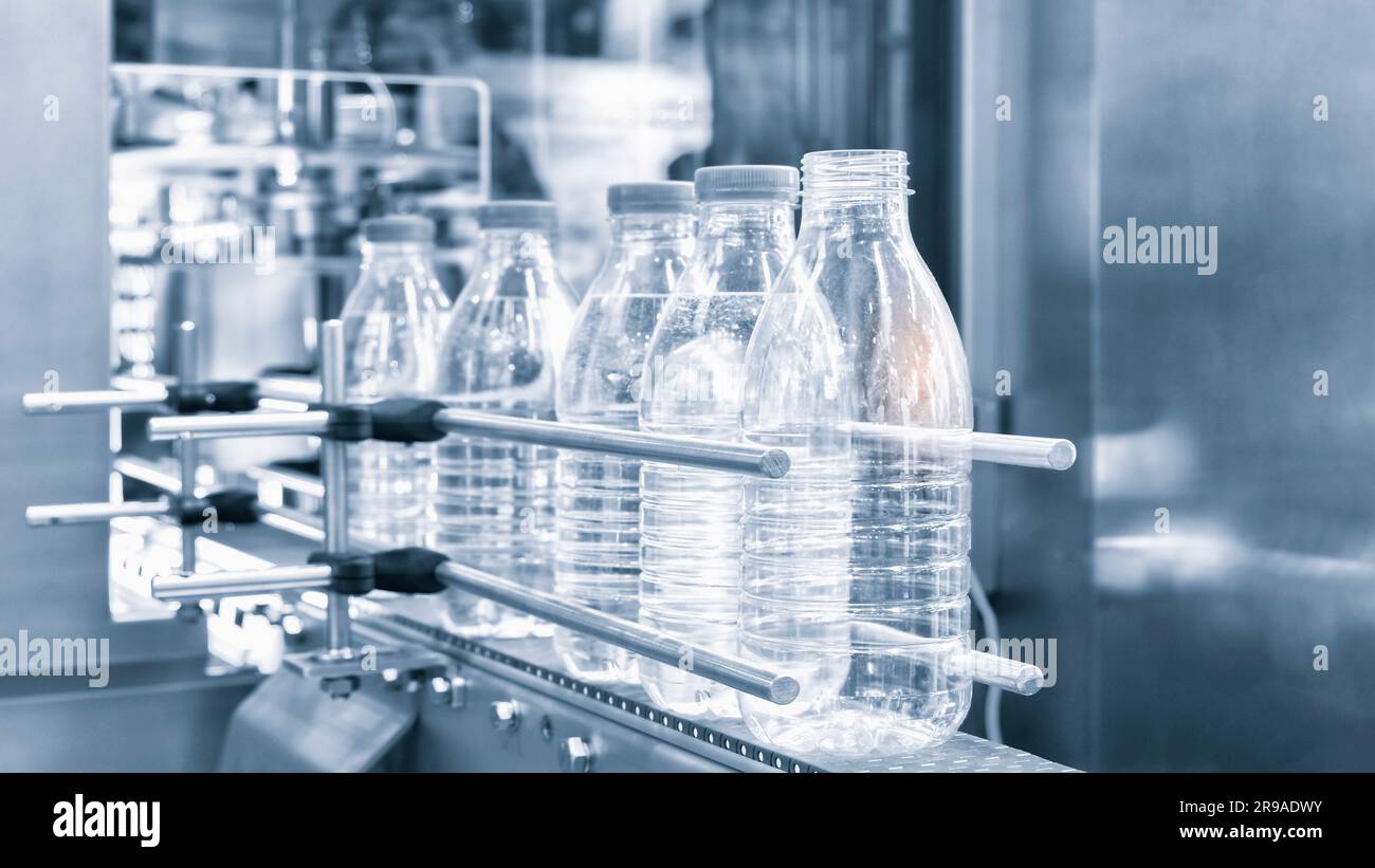 Bottle. Industrial production of plastic pet bottles. Factory line for