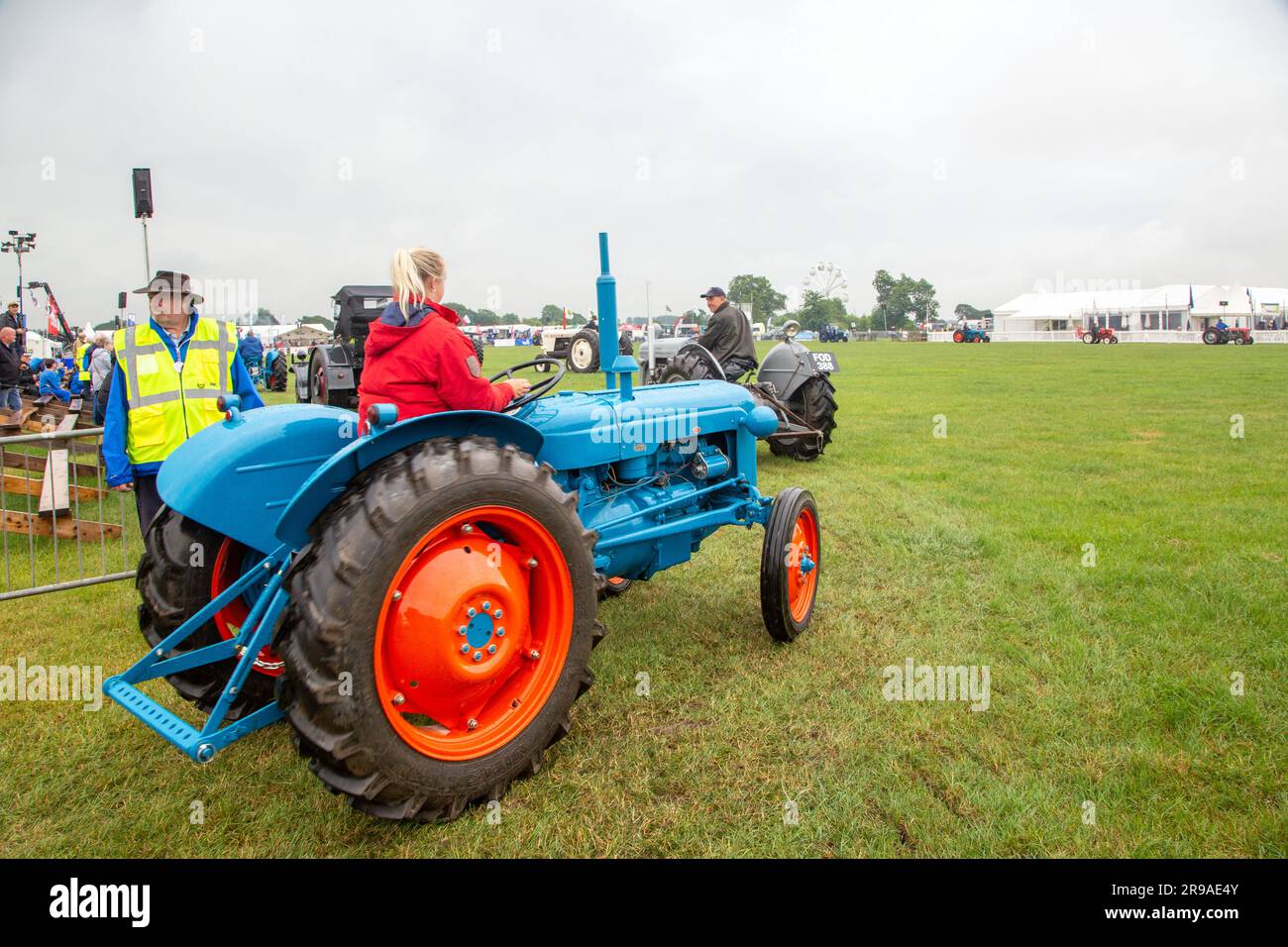 Vintage tractors entering the show ring at the Royal Cheshire show of 2023 at Tabley Knutsford Cheshire Stock Photo