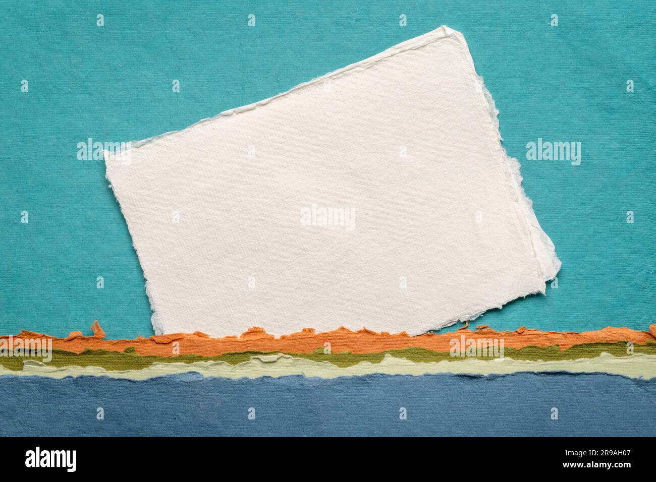 small sheet of blank white Khadi rag paper from India against abstract