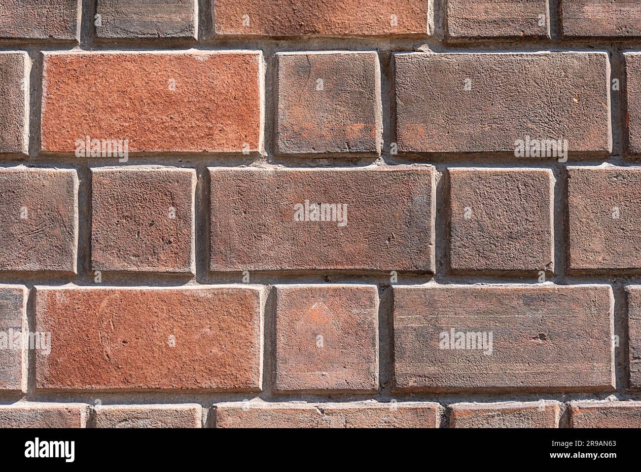 Background from a dark red brick wall Stock Photo