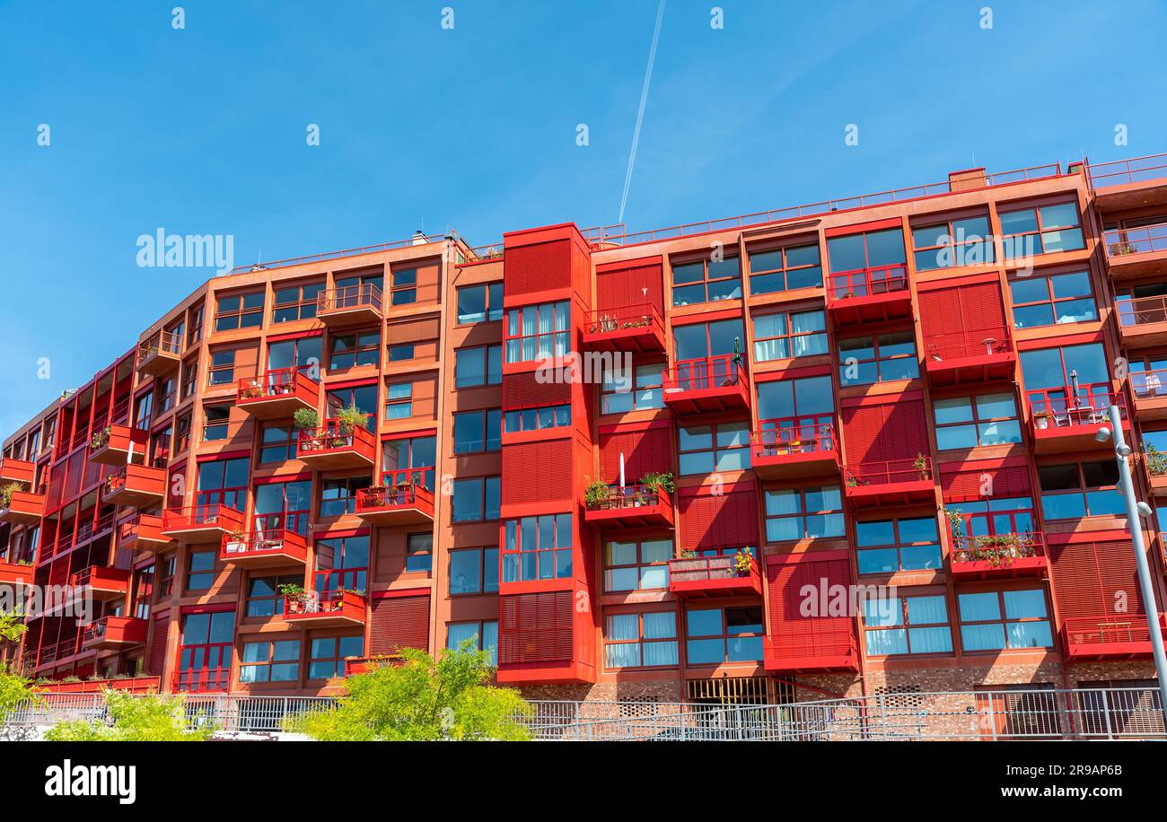 Newly built red apartment building seen in Berlin, Germany Stock Photo