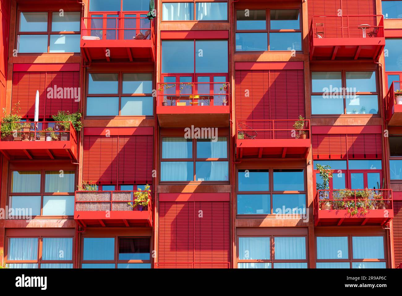 Facade of a red apartment building seen in Berlin, Germany Stock Photo