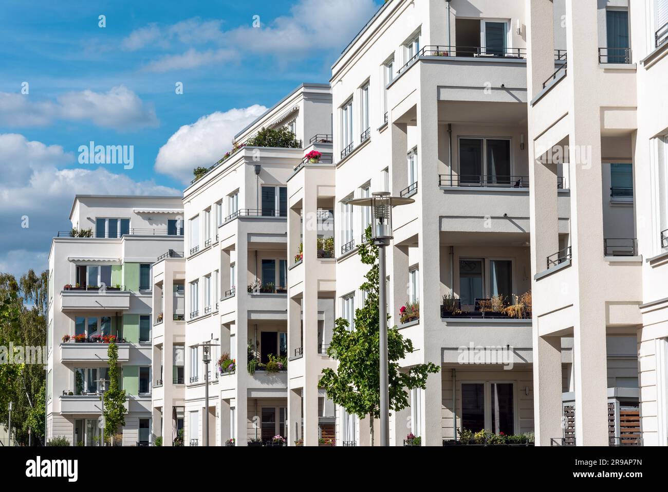 The facade of a row of modern apartment buildings seen in Berlin ...