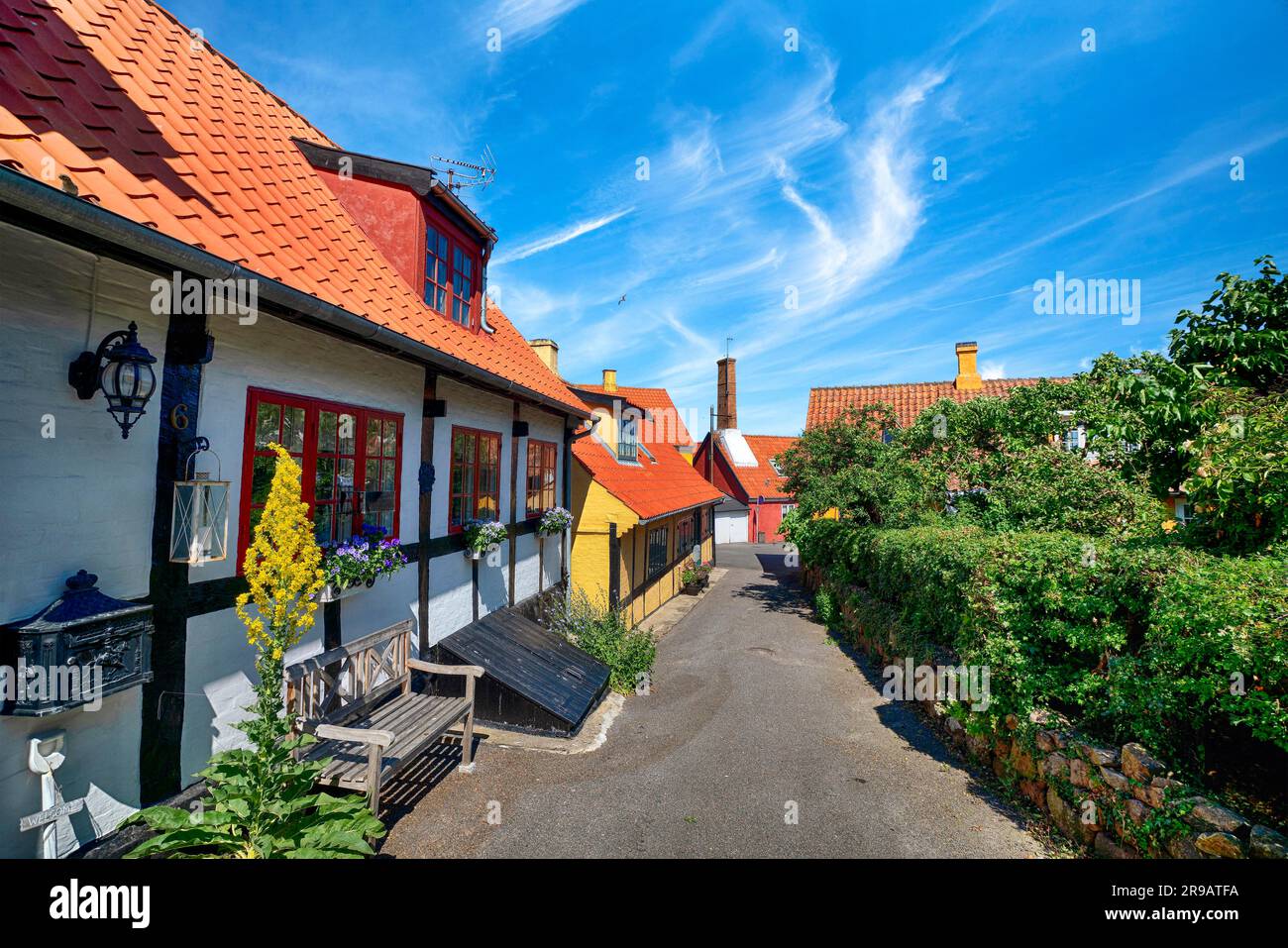 Scandinavian street in a small village in the summer with colorful buildings under a blue sky Stock Photo