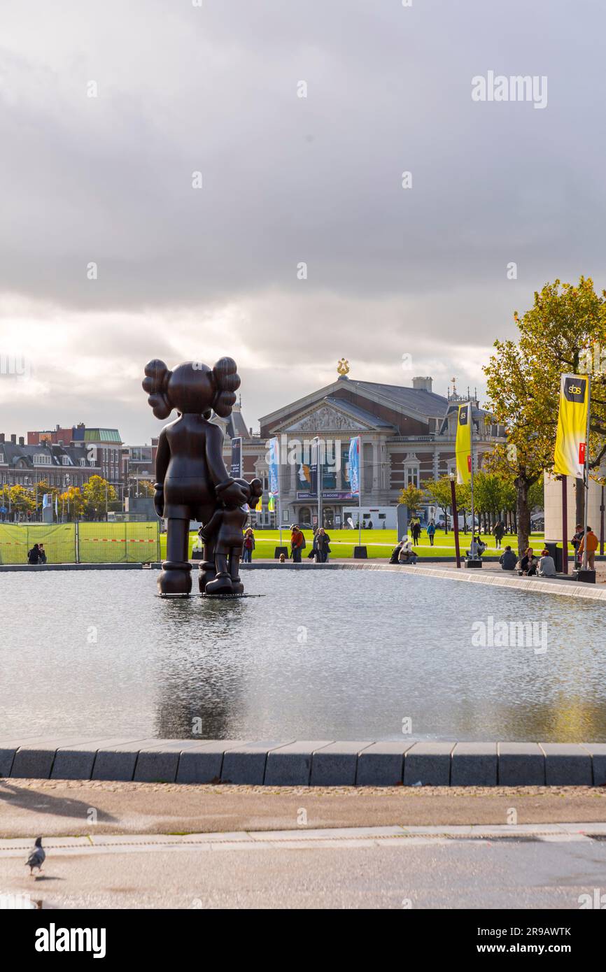 Amsterdam, NL - October 12, 2021: Modern sculpture from the New Jersey artist Kaws displayed at the Museumsplein, Amsterdam. Stock Photo
