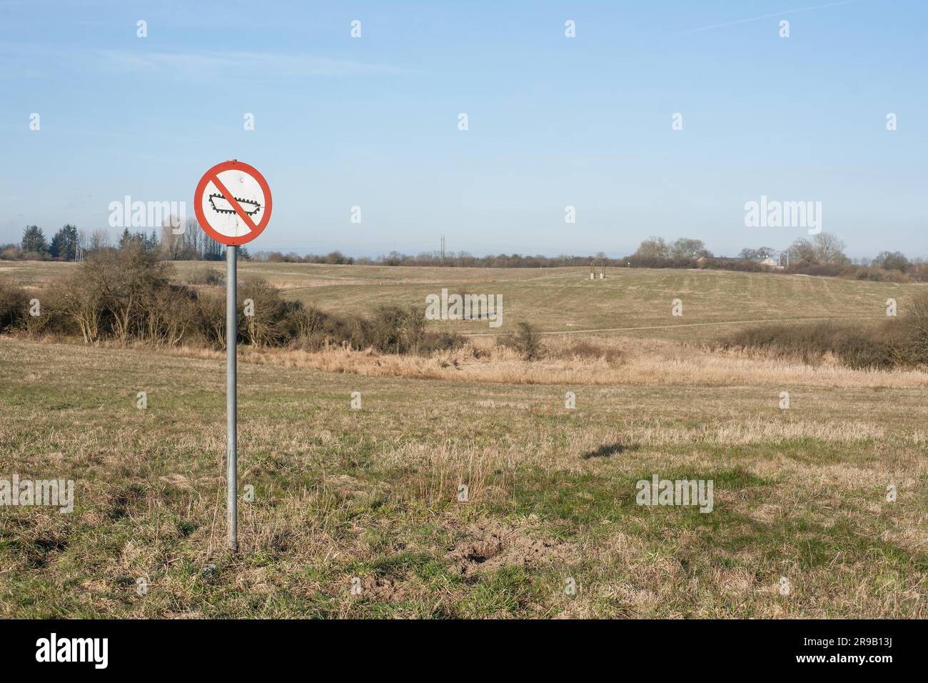 Forbidden tank sign on a restricted area field Stock Photo