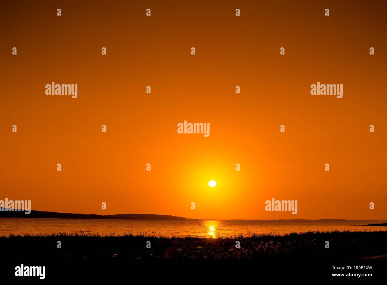 Beautiful sunrise over a lake in the morning Stock Photo
